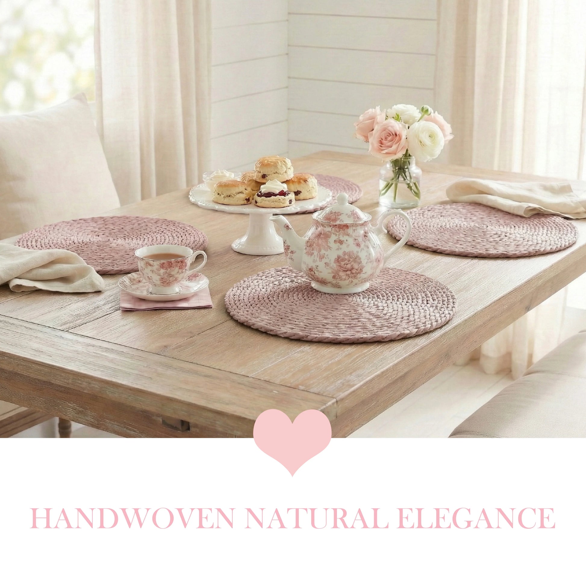 Pale pink round halfa grass placemats set on a rustic wooden dining table for afternoon tea, featuring a floral teapot, scones, and blush roses in a bright farmhouse setting.