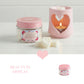 Pink candle holder with heart design and a jar labeled 'Scent of Love' on a white background.

