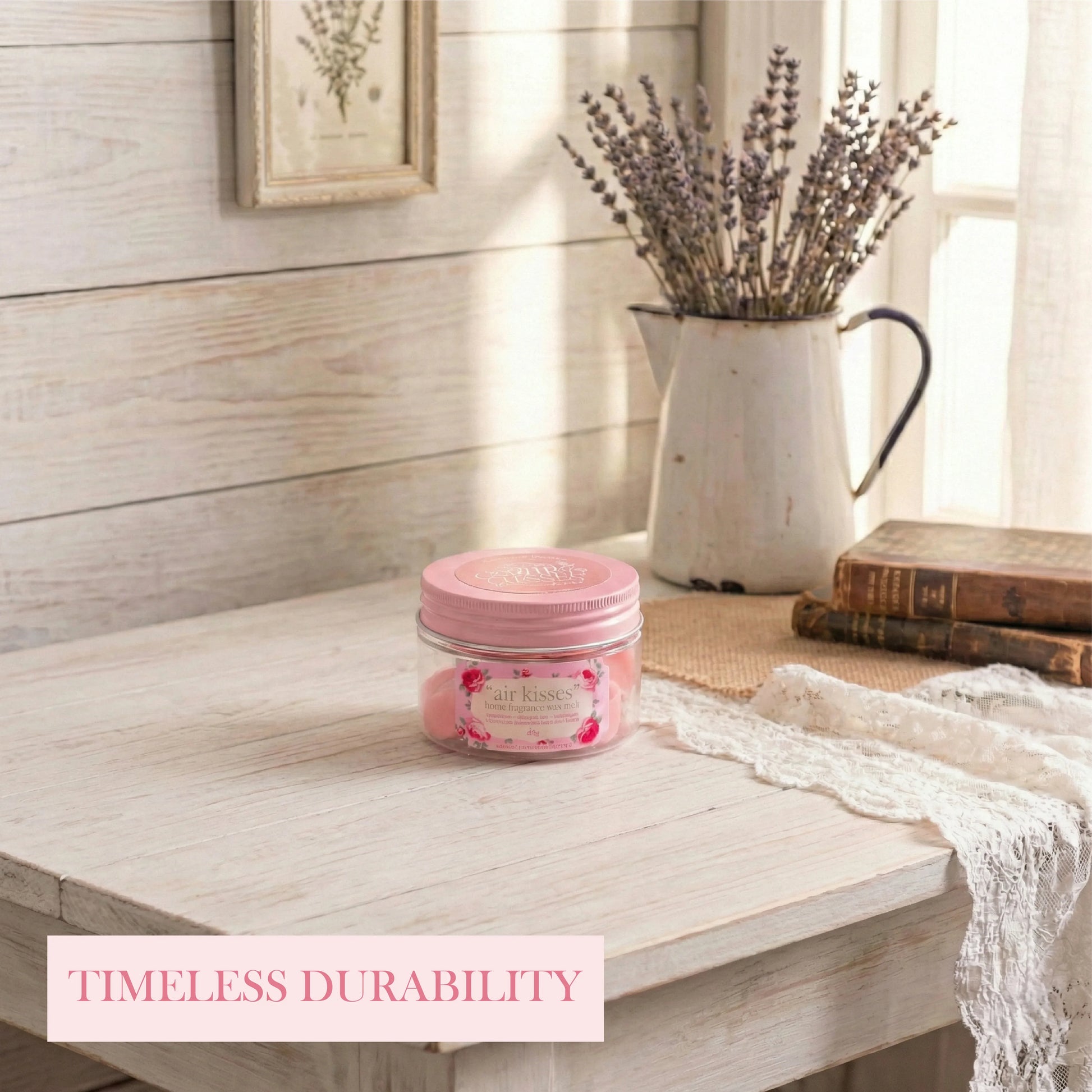 Pink jar on a wooden surface with a vase of lavender in the background

