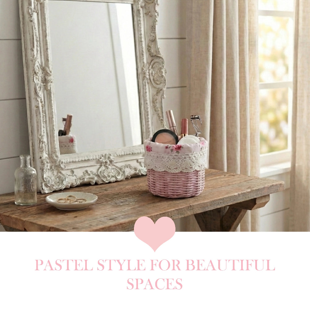 Pink mini wicker basket with cosmetics on a rustic table in front of an ornate white mirror and pink heart graphic.