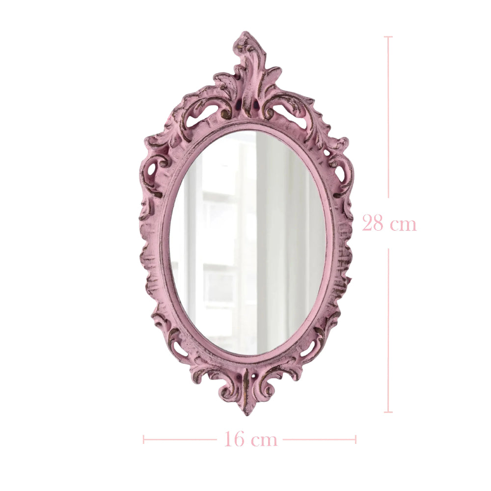 Ornate pink oval mirror with distressed edges showing dimensions of 28 cm in height and 16 cm in width.