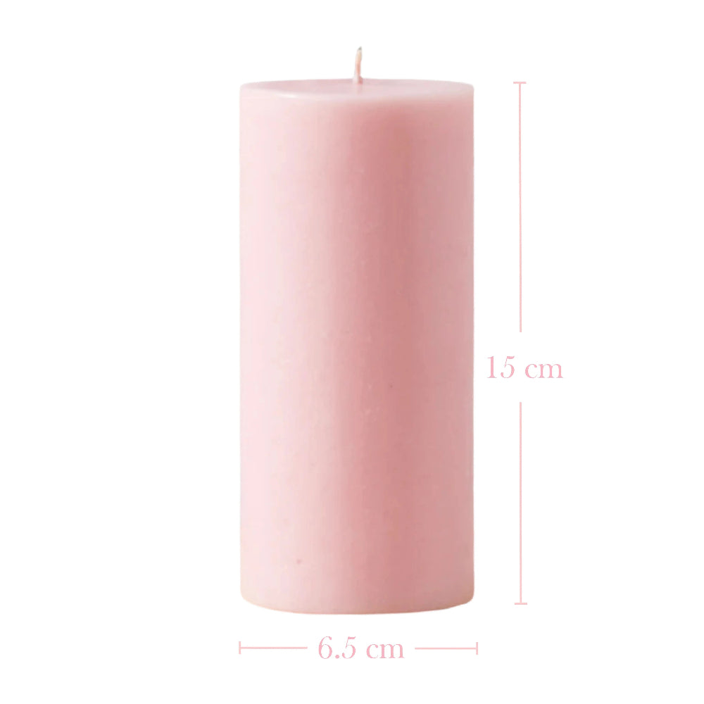 Pink pillar candle shown with dimension lines indicating a height of 15 cm and a width of 6.5 cm.