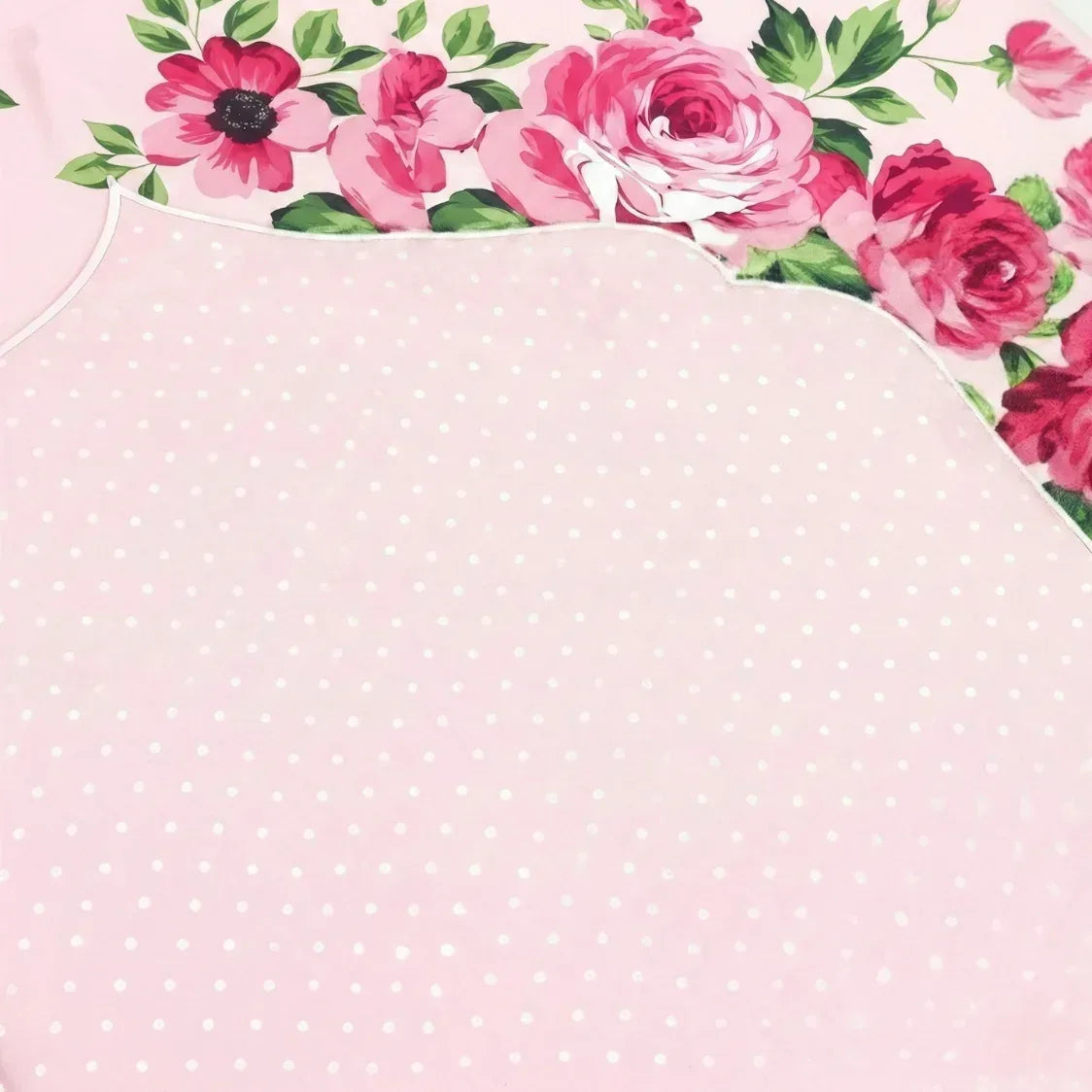 Pink polka dot fabric with floral border