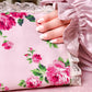 Women wearing Armenian satin pink polka dot isdal holding quran 