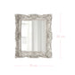 Decorative mirror with ornate frame and dimensions on a white background