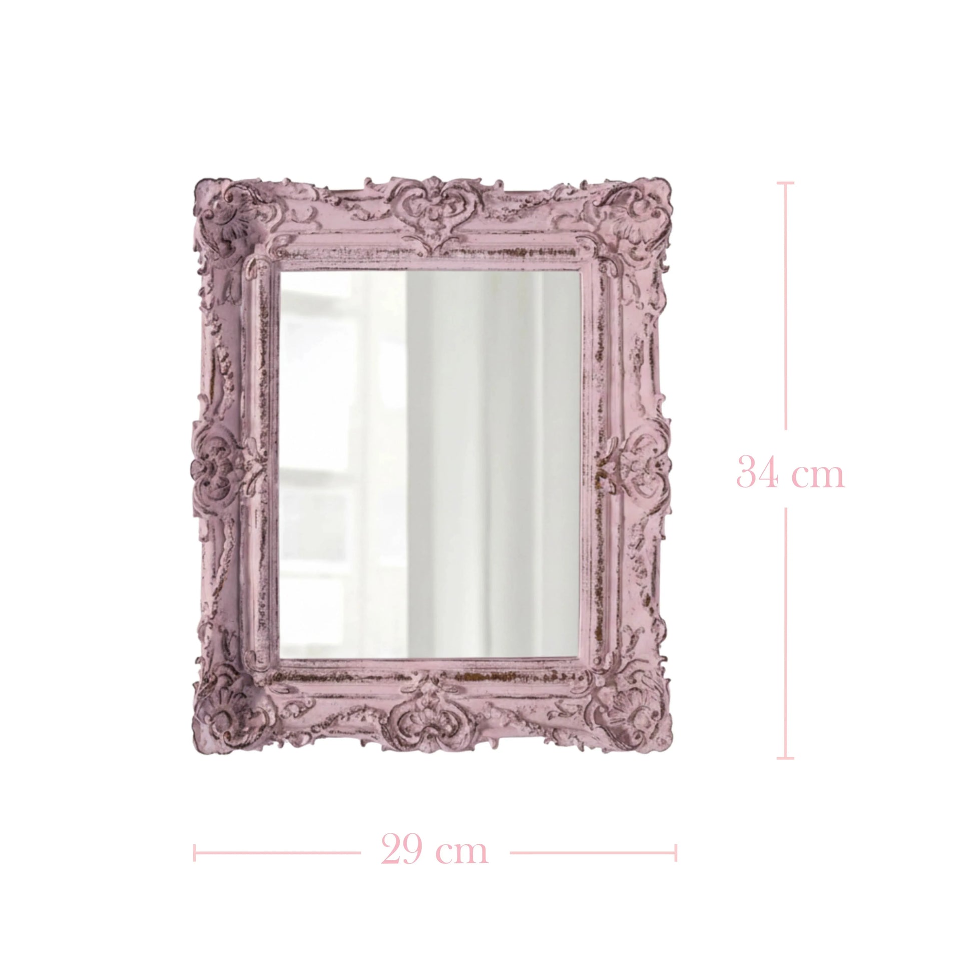Decorative pink mirror with intricate details and dimensions on a white background