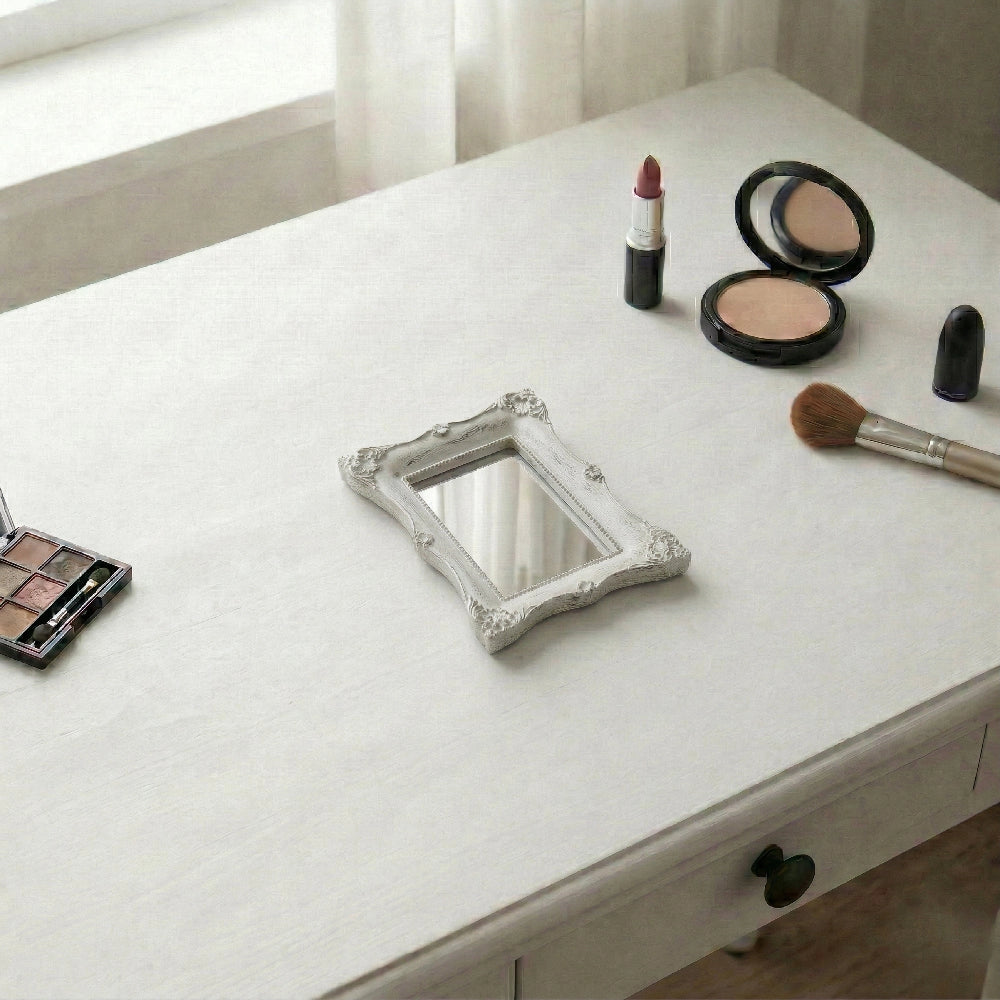 Pretty Shabby Wall Mirror – Rectangular Chic displayed with makeup essentials on a white surface
