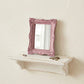Pretty Shabby Wall Mirror – Rectangular Chic displayed on a white shelf against a beige wall