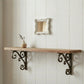 Pretty Shabby Wall Mirror Square Chic above wooden shelf with decorative brackets on white paneled wall