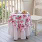 Round table with floral tablecloth on a wooden deck
