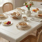 Round Wicker Placemat on dining table set for breakfast with food and teapot arrangement for Country Charm home décor