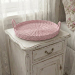 Round Wicker Tray placed on bedside night table for home decor storage and styling
