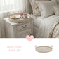 Round Wicker Tray placed on bedside table with floral bedding decorative home styling setup