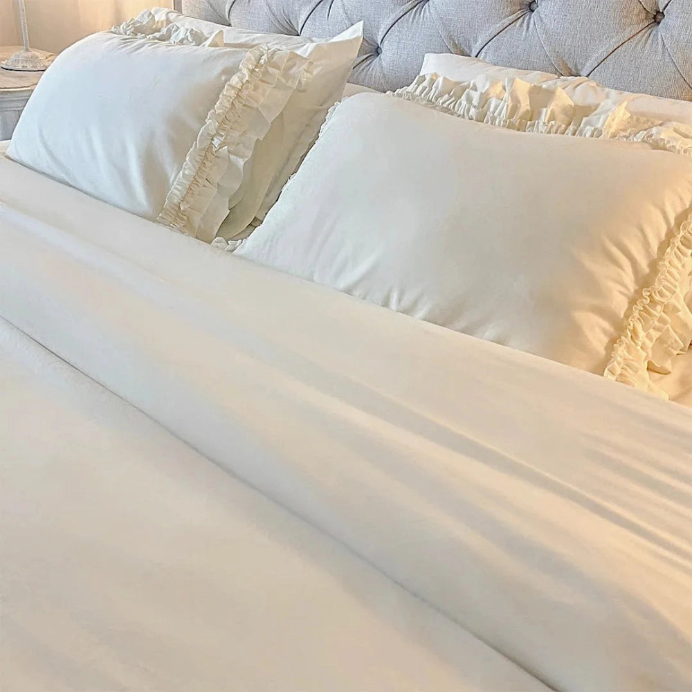 Ruffled Bedding Set cream pillowcase pair with textured ruffle edges displayed for bedroom styling