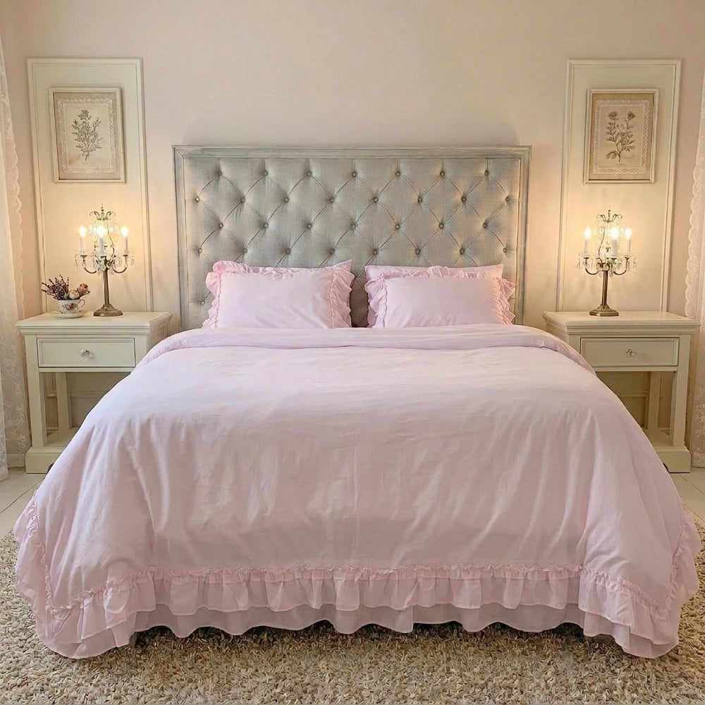 Ruffled Bedding Set in pale pink styled on a bed with tufted headboard in a bedroom