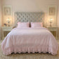 Ruffled Duvet Cover styled on a bed with tufted headboard in a bedroom