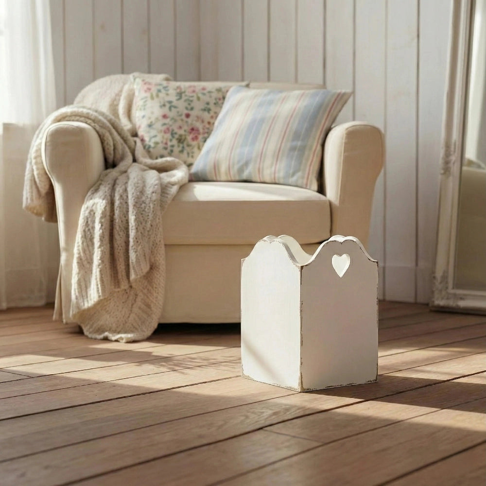 Rustic Heart Cut Out Wooden Basket displayed with beige armchair, pillows, blanket, and heart cutout table