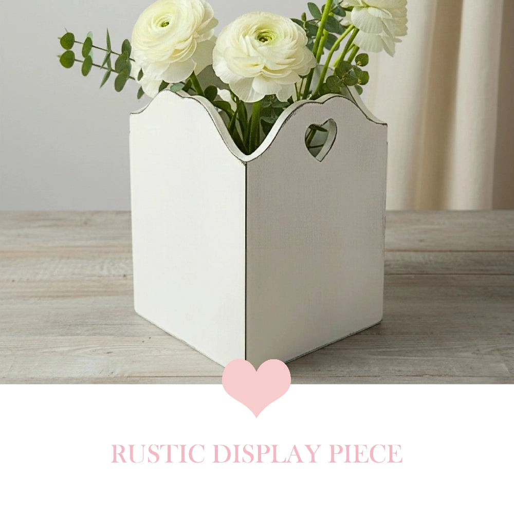 Rustic Heart Cut Out Wooden Basket with white flowers displayed on wooden surface