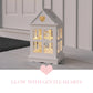 Rustic Wooden Heart Cut-Out Lantern on floor displaying heart-shaped cutouts and warm candle glow