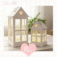 Two illuminated lanterns with heart designs on a wooden surface, featuring a '15% off' offer.