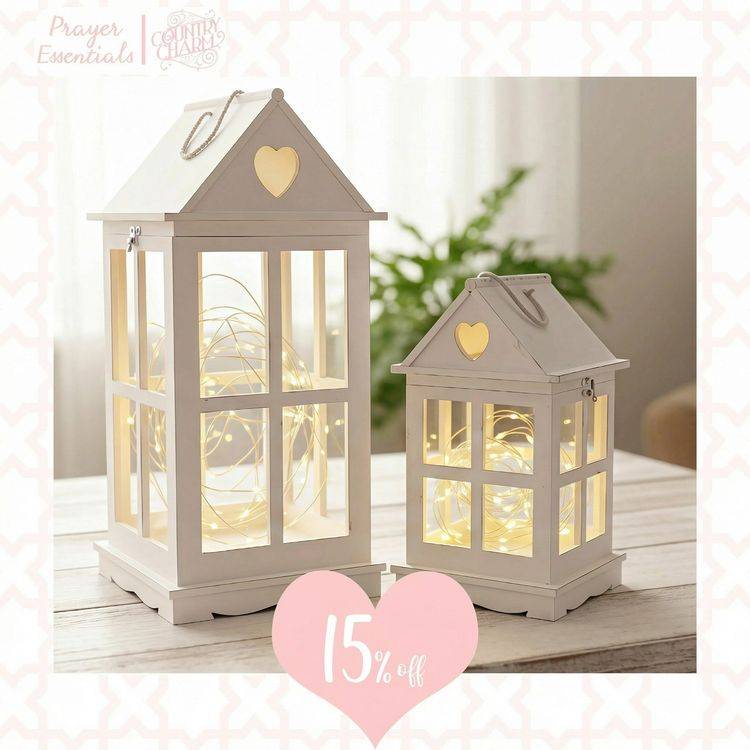 Two illuminated lanterns with heart designs on a wooden surface, featuring a '15% off' offer.