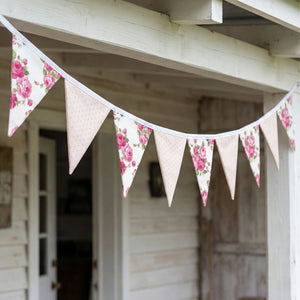 Shabby Chic Fleur & Polka Dot Pennant Banner Flag featuring pink rose floral and neutral polka dot triangle flags hanging across a rustic white wooden porch.