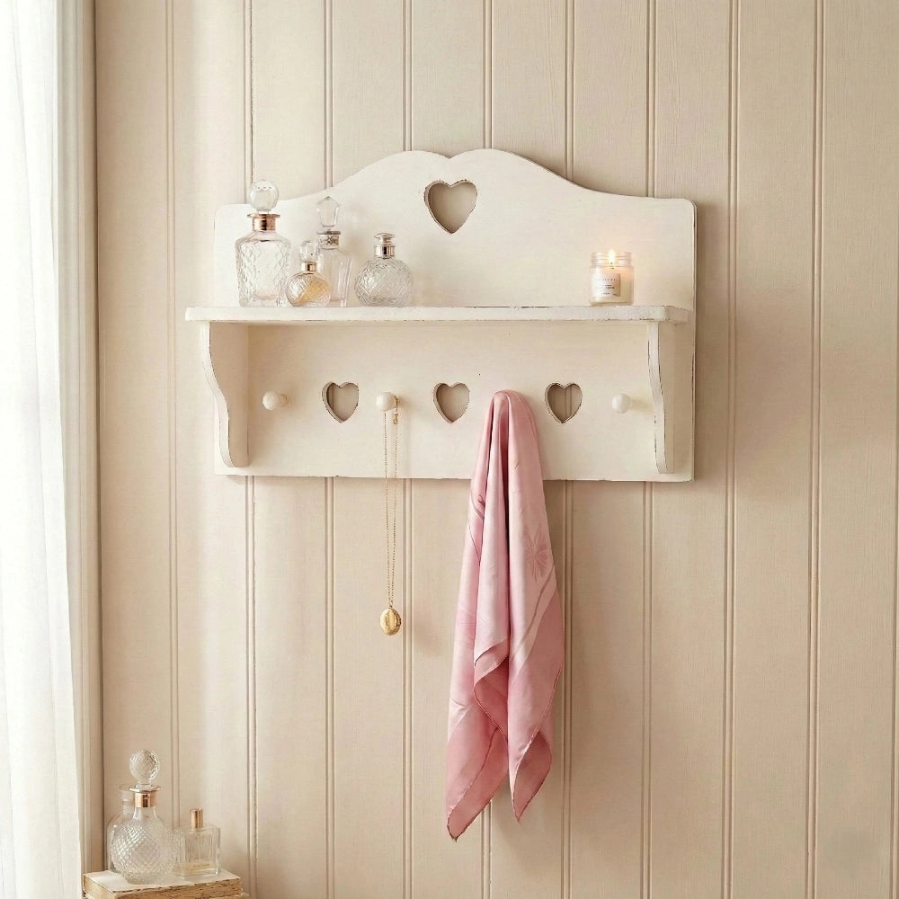 Shabby Chic Heart Cut-Out Wall Shelf with candles and pink towel on white shelf