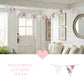 Living room with floral bunting, white walls, and decorative elements.