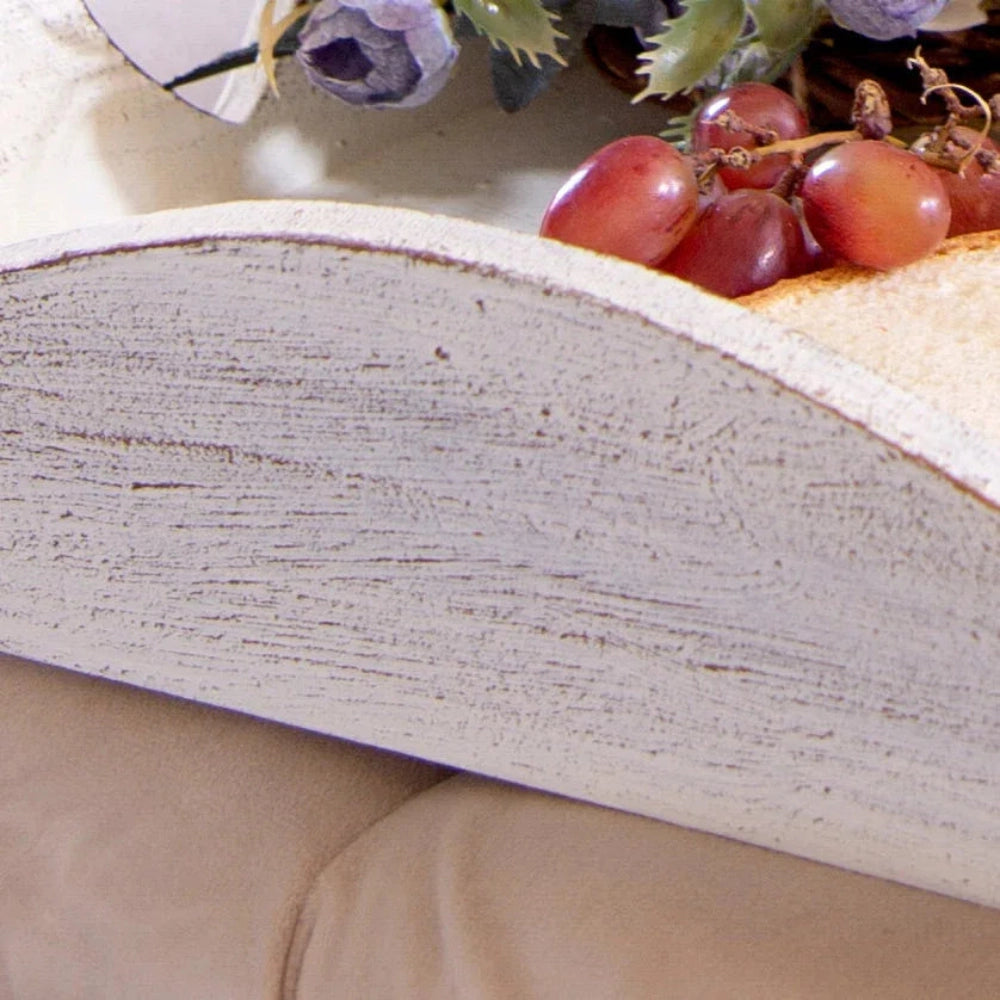 Close-up of a tray with grapes and flowers on a beige surface