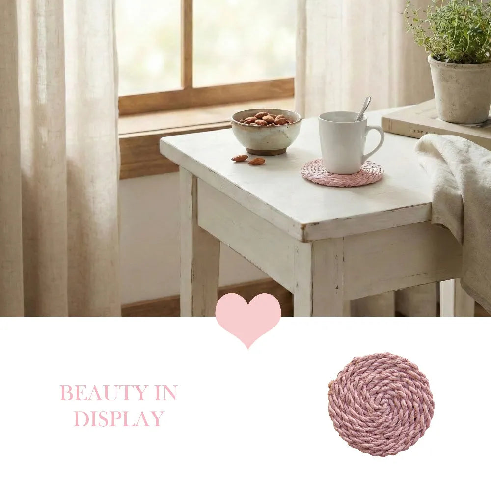White table with a mug, bowl, and pink woven coaster in a bright room.