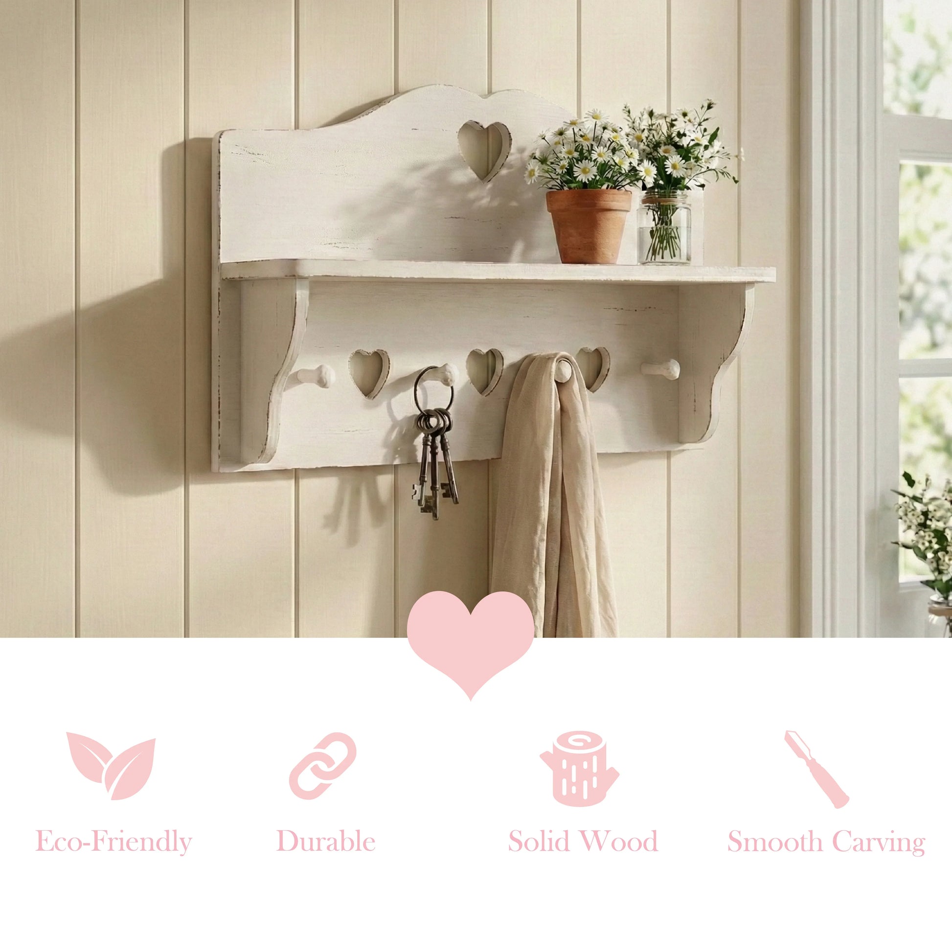 White wall shelf with heart-shaped cutting hooks and decorative items hanging on a light wooden shelf wall.