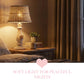 Wicker Shade Side Lamp on Napoleon III style wooden table with wicker shade illuminated