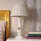 Wicker Shade Side Lamp with rustic wooden base on white background