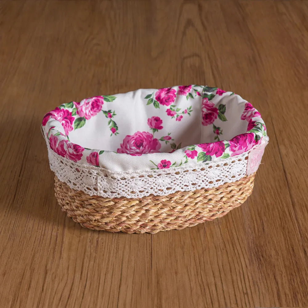 Woven basket with floral fabric lining on a wooden surface
