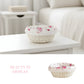 Woven Cottage Round Wicker Basket with floral pattern on a white surface, with 'Beauty in Display' text.