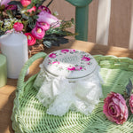 Cream tin jar with floral print lid and lace detail