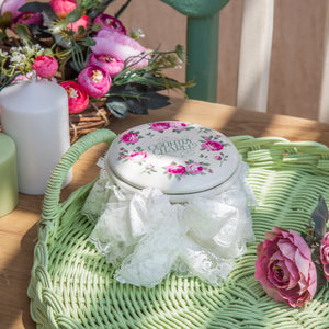 Cream tin jar with floral print lid and lace detail